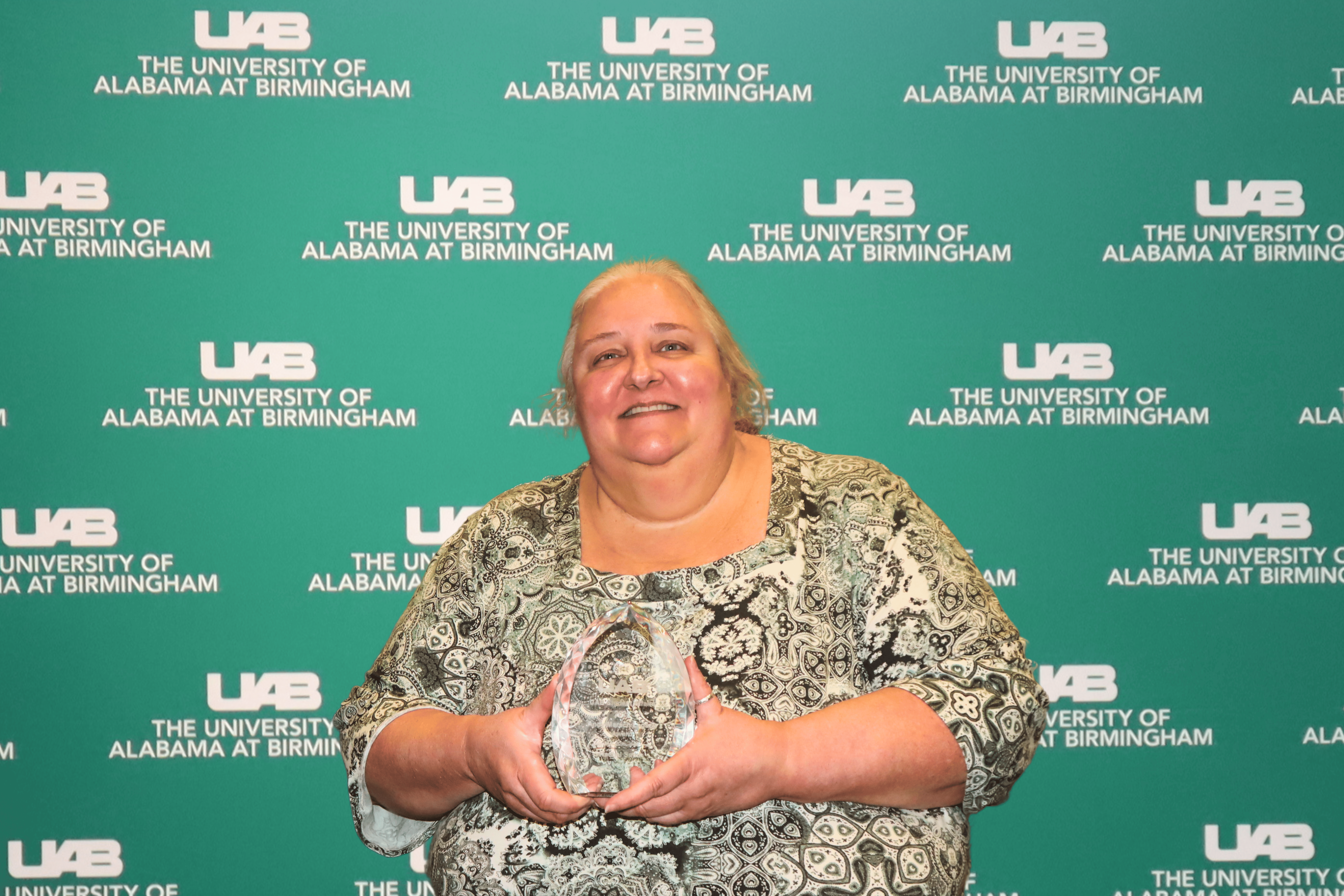 Rachel Smith with the Andy Marsch Legacy Award at 2025 End of the Year Luncheon