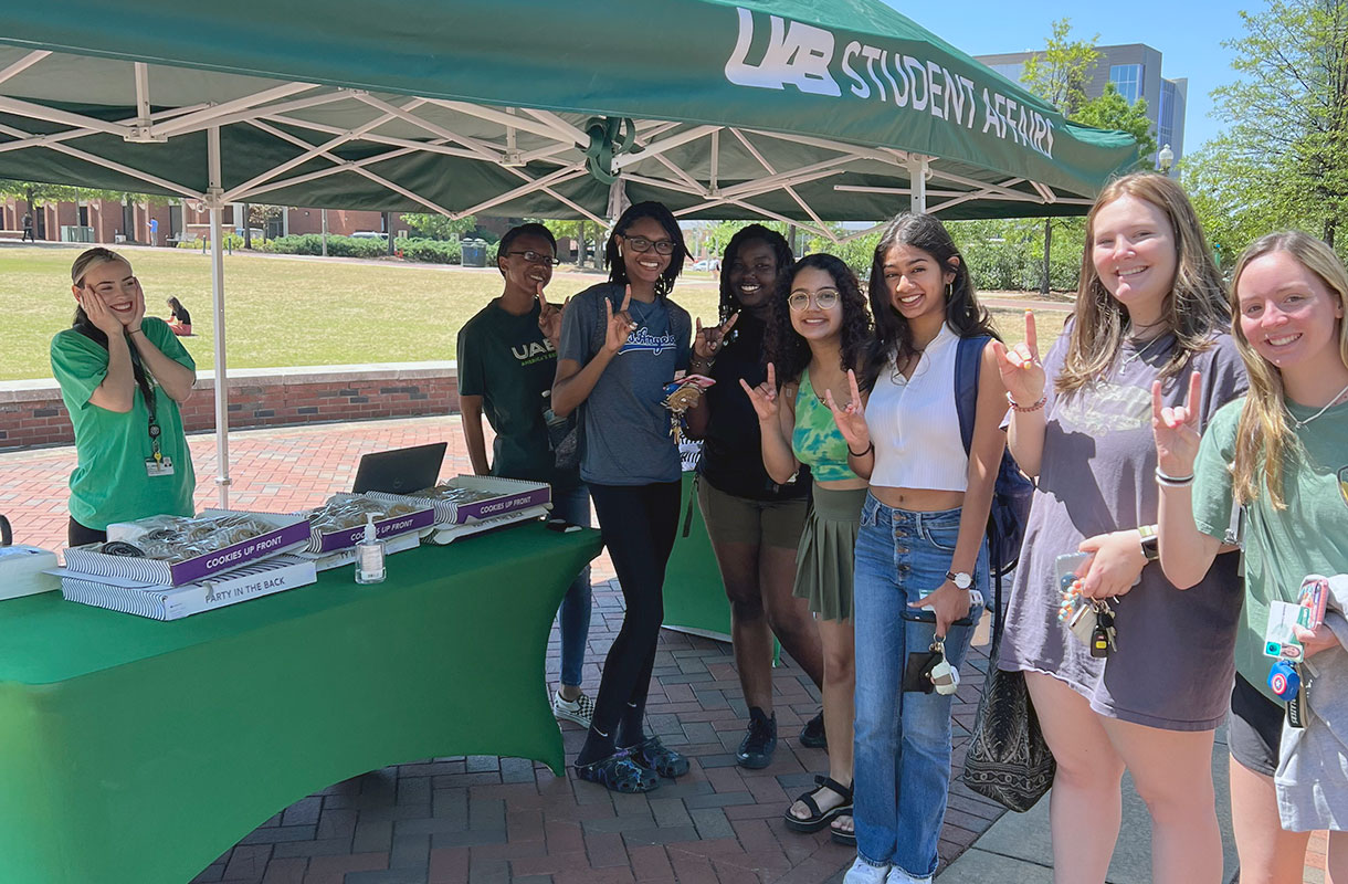 Students in line at a Student Affairs tent on the UAB Green.