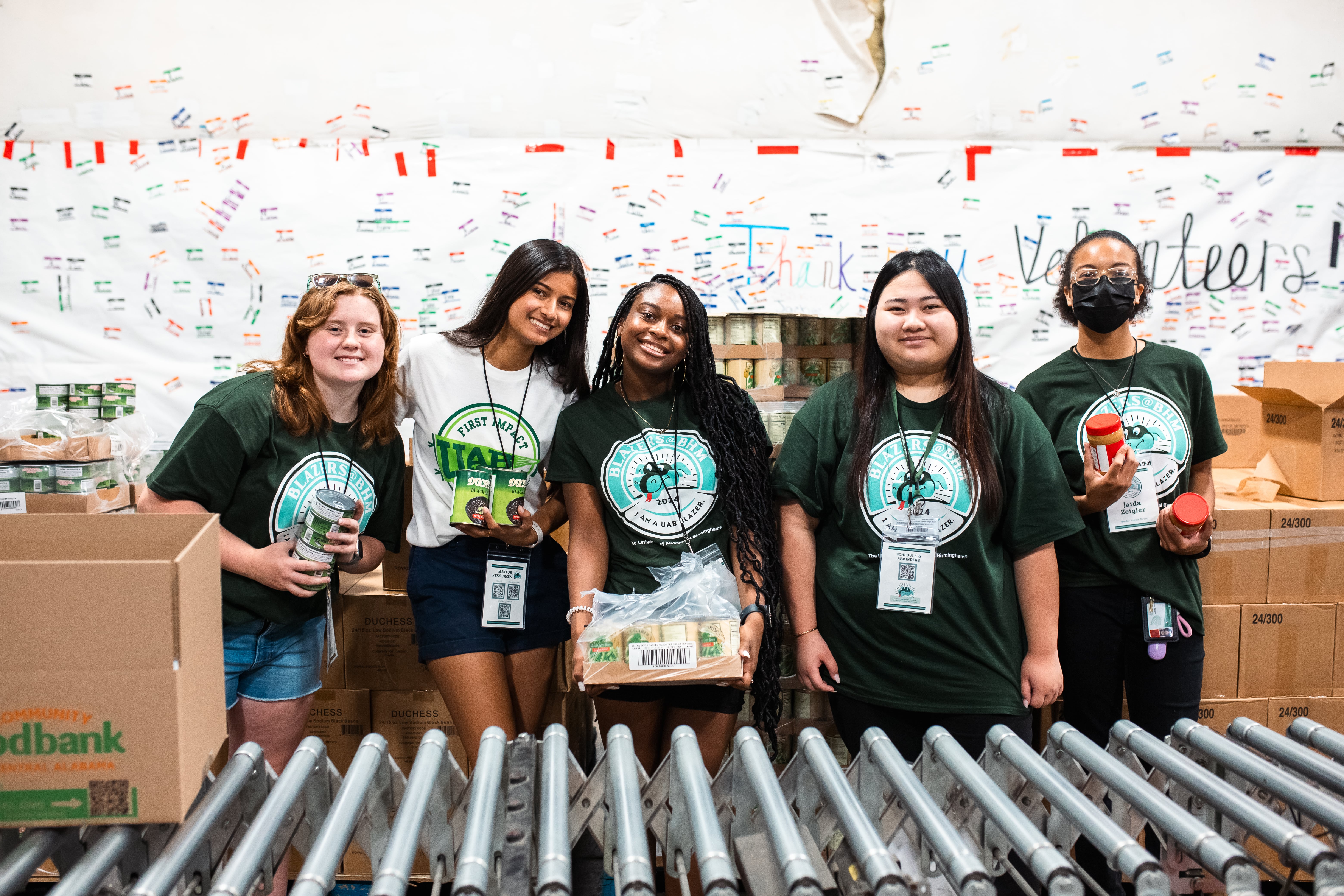 Students gathered around a display table