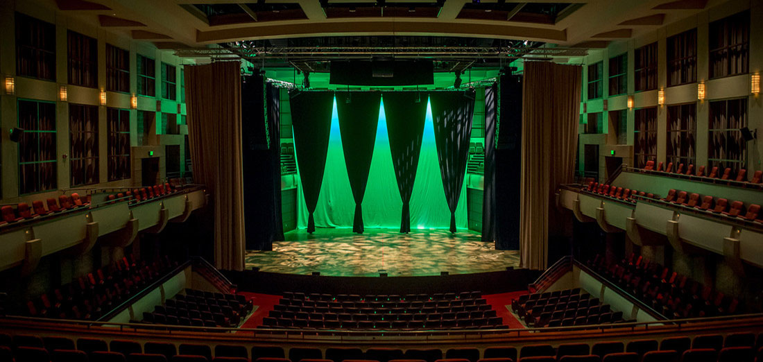 Photo of the stage and grand drape in the Jemison Concert Hall