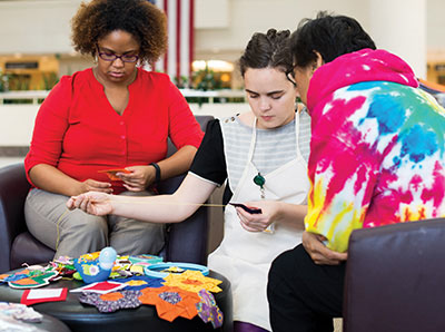 Photo of Lillis Taylor and sewing class