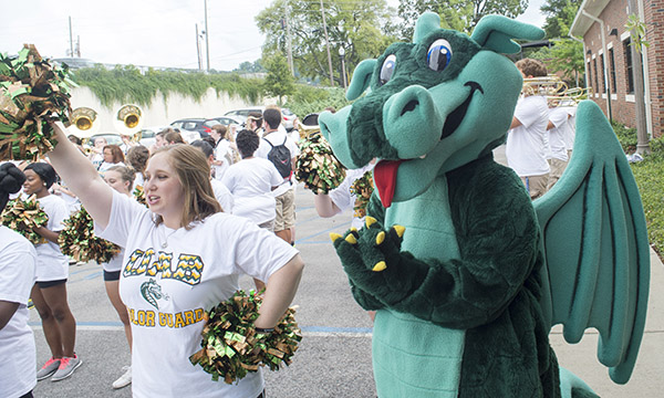 Photo of color guard and Blaze at athletics campaign pep rally