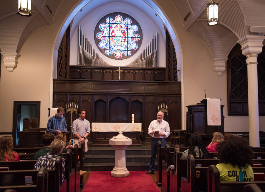 Photo of tour leaders and Pastor Webster inside First Presbyterian