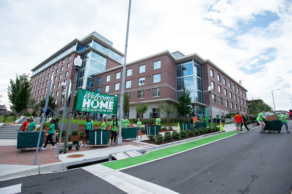 Photo of volunteers lined up outside New Freshmen Residence Hall