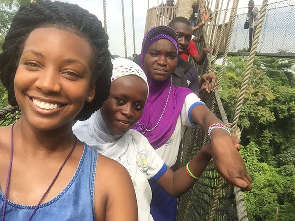 Photo of Shanquela Williams with friends on canopy walk above the rainforest