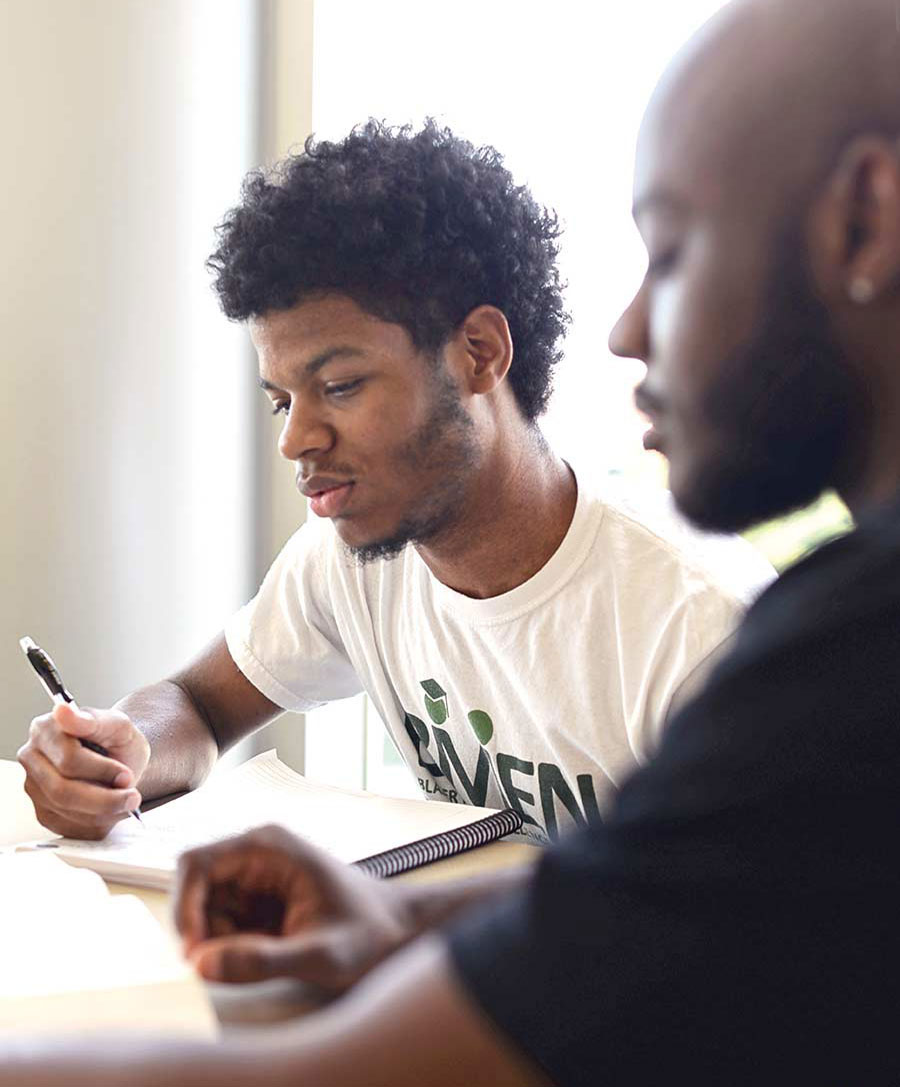 Photo of Trevor Stewart and Jeremy Blackmon working together