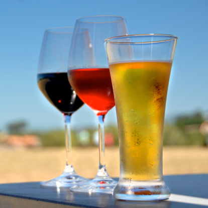 Photo of full wine and beer glasses