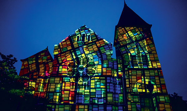 Light projection on Spencer Honors House during Light Dreams