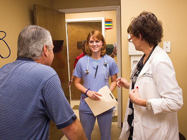 Somerall with a nurse practitioner at the School of Nursing's Foundry clinic.