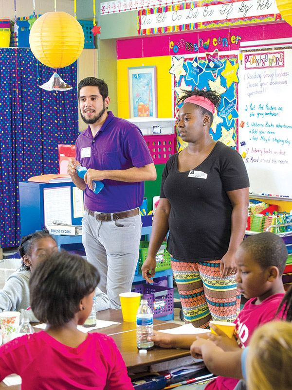 Photo of Daniel Mendoza and Dessie Chandler talking with Rocky Ridge class