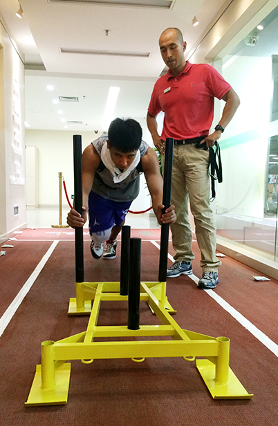 Photo of Chuan Wang working with a patient.