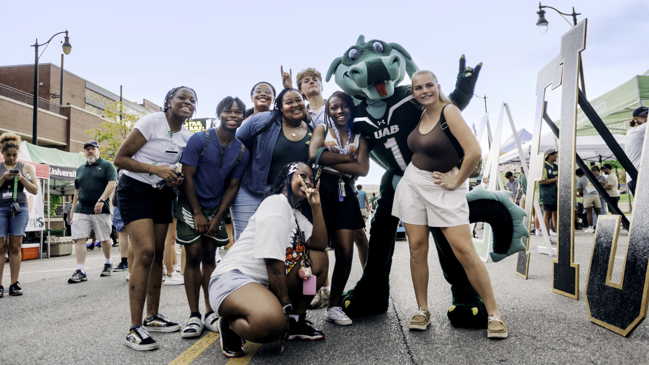 Blaze with students outside Protective Stadium.