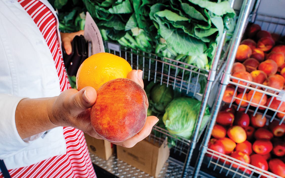 Photo: Hands holding colorful fruit