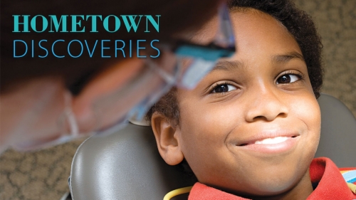 Photo of smiling boy in dentist chair