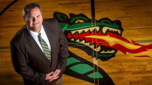 Photo of Mark Ingram with UAB Blazers shield