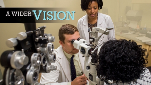 Photo of optometry student and faculty examining patient