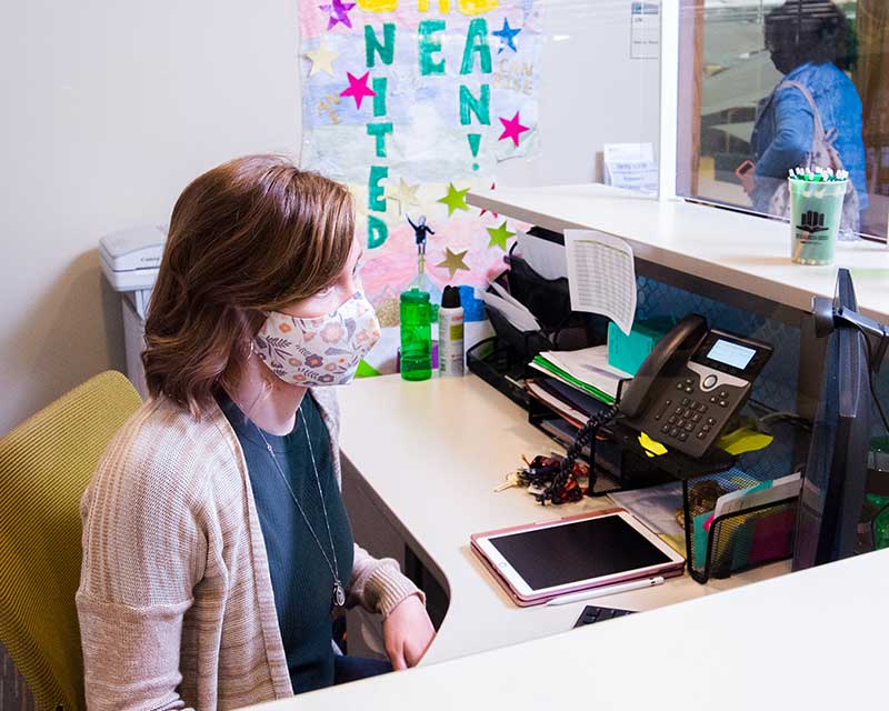 UAB Writing Center receptionist welcoming visitors